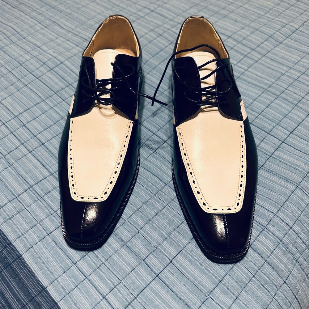 Black and white Giovanni Merrick dress shoes.